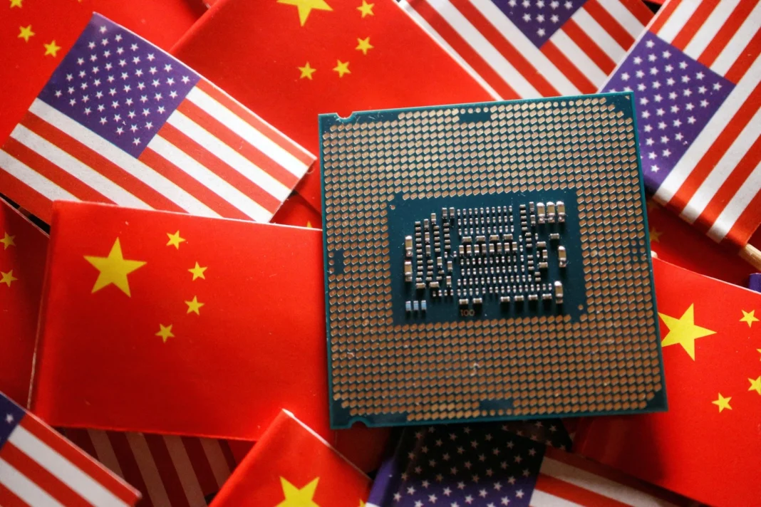 A central processing unit semiconductor chip is displayed among flags of China and U.S., in this illustration picture taken February 17, 2023. REUTERS/Florence Lo/Illustration/File Photo