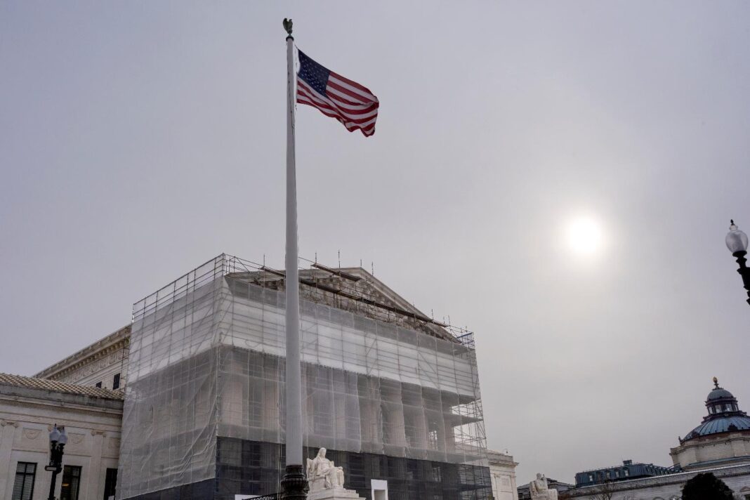 With the Supreme Court Building under renovations, the justices hear oral arguments on President Donald Trump's push to expand control over independent federal agencies, on Capitol Hill in Washington, Monday, Dec. 8, 2025. (AP Photo/J. Scott Applewhite)