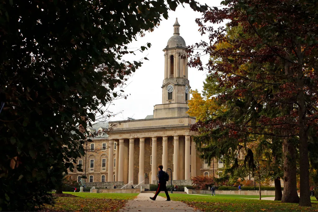 A student walks on the Penn State University campus.