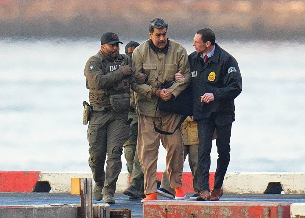 Federal agents escort Nicolas Maduro at a helipad in New York City on Monday.